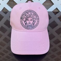 Versace Cap Unisex (Pink With Signature Logo) Size 58 Brand New With Tag, Never Been Worn Bought Directly From The Versace Store Trendy Pink Trucker Hat With Curved Visor, Pink Streetwear Hats, Pink Hat With Embroidered Logo For Streetwear, Pink Embroidered Logo Hat For Streetwear, Pink Snapback Baseball Cap With Embroidered Logo, Pink Streetwear Hats With Embroidered Logo, Trendy Pink Flat Brim Baseball Cap, Pink Visor Baseball Cap With Embroidered Logo, Pink Baseball Cap With Embroidered Logo, One Size