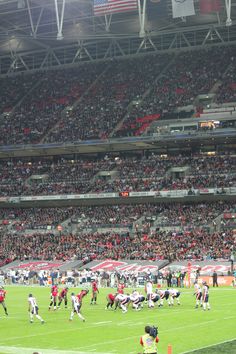 a football game is being played in an empty stadium