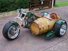 a motorcycle with a wooden barrel as the seat