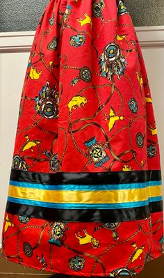 Rare Vintage Cotton Fabric Ribbon Skirt   Handmade Ribbon Skirt  Waist- any size up to 40" *Please include waist measurements in inches Length-32" Plus sizes available in most designs for any waist measurement over 41". See Plus size listing and add additionally to your cart along with this skirt listing. Red Southwestern tribal Background. Design features: Tomahawk, Shield, Feathers, Animals, Buffalo, Medicine pouch *No holds, cancellations, returns or refunds Red Flowy Maxi Skirt For Festival, Bohemian Red Full Skirt, Traditional Red Skirt With Patterns, Traditional Red Skirt With Traditional Patterns, Traditional Red Flowy Skirt, Traditional Red Flared Skirt, Traditional Red Lined Skirt, Traditional Red Flowy Maxi Skirt, Traditional Red Flared Maxi Skirt