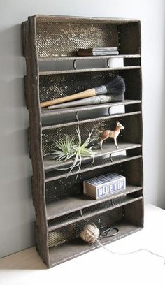 an old wooden shelf with various items on it