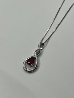 Sterling Silver Garnet Diamond Accent Moveable Dangle Pendant Necklace. This necklace is 18 inches in length; pendant is 1 1/4 inches in length and 1/2 inch in width; necklace weighs a total of 4.37 grams. Necklace is tested and stamped sterling silver. This pre-owned vintage necklace is in good condition and is ready to be worn! Willing to answer any questions and send more pictures if requested, please feel free to ask! Please come check out other stunning unique jewelry pieces listed in our s Diamond Pendant Necklace, Diamond Pendant, Vintage Necklace, Pendant Necklaces, Jewelry Pieces, Garnet, Necklace Etsy, Jewelry Necklace Pendant, Jewelry Necklaces