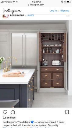 a kitchen with white counter tops and wooden cabinets in the center is an open pantry