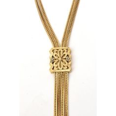 This is part of Chairish’s Fine Jewelry assortment.  This signed vintage Monet lariat gold filled necklace now is so chic. It is from the 60's. The chain form on each strand is elegant. The lariat medallion can go up and down to secure different placement. It has the 4 drop pendant forms at the end. It is 17.5" H / L on the neck. Lariat necklaces are very in vogue now. Gold-tone Luxury Lariat Necklace For Formal Occasions, Luxury Gold-tone Lariat Necklace For Formal Occasions, Gold Brass Lariat Necklace, Elegant Yellow Gold Lariat Necklace In Brass, Elegant Yellow Gold Brass Lariat Necklace, Vintage Multi-strand Gold Jewelry, Vintage Gold Multi-strand Jewelry, Elegant Lariat Brass Jewelry, Elegant Brass Lariat Jewelry