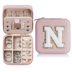 a pink case filled with lots of jewelry