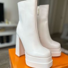 We Want Fashion And Comfort Period! This Block Platform Heels Bootie Is Another Level Of Comfort. Block Heel Platform Pu This Miss This Beauty In Your Size Runs True To Size Heels: 5.5 Inches Platform 2.5 Inches White Medium Width Heeled Boots For Party, White Platform Boots With Reinforced Block Heel, White Platform Heeled Boots With Pointed Toe, White Stacked Heel Boots For Party, White High Heeled Boots With Padded Heel, White Platform Heeled Boots For Party, White Block Heel Boots For Party, White Party Boots With Stacked Heel, White Block Heeled Boots For Party