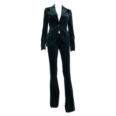 Vintage Gucci Dark Green Velvet Pant Suit 2005 Collection Italian size 38 - US 2 Buttons with Gucci signature, Black suede leather detail on shoulders and sleeves, G logo embroidery on pant's back pocket, Lined. Pants: waist - 28 inches, rise - 8", hips - 34", unfinished inseam 36.5" Jacket: shoulders - 14.5 inches, length - 26", sleeves - 25" 97% Cotton, 3% Poliurf Made in Italy. New, with tags. Luxury Gucci Elegant Bottoms, Luxury Fitted Gucci Bottoms, Luxury Elegant Gucci Pants, Gucci Luxury Full Length Pants, Luxury Full Length Gucci Pants, Chic Gucci Party Bottoms, Gucci Designer Fitted Pants, Velvet Pant Suit, Fatale Aesthetic