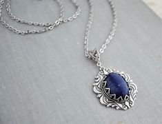 Lapis Lazuli Necklace. Cabochon measures 18x13mm. Pendant measures 32x25mm. Chained in nickel free silver plated chain. Closes with a lobster clasp. Length pictured is 18 inches long. See the matching earrings here: https://www.etsy.com/your/shops/WearitoutJewelz/tools/listings/stats:true/675449046 Visit my shop today to see other great items. :) http://www.etsy.com/shop/WearitoutJewelz ♥ All items carefully packaged in a pretty gift box. Lapis Jewelry, Lapis Lazuli Jewelry, Lapis Lazuli Earrings, Lapis Lazuli Necklace, Necklace Gemstone, Pretty Gift, Dream Clothes, Gemstone Necklace, Matching Earrings