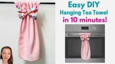 a woman standing next to a pink towel hanging on a wall with the words easy diy hanging tea towel in 10 minutes