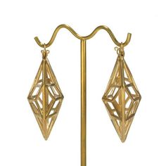 Tawapa's Solar Hoops in yellow gold. Gold Geometric Brass Jewelry, Gold Diamond-shaped 14k Earrings, Gold Geometric Earrings For Formal Occasions, Geometric 14k Yellow Gold Jewelry, Clothes Hanger, Solar, Plating, Yellow Gold, Yellow