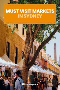 people walking down the street in sydney with text overlay that reads must visit markets in sydney