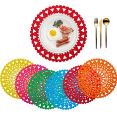 an assortment of colorful plates and utensils on a white background