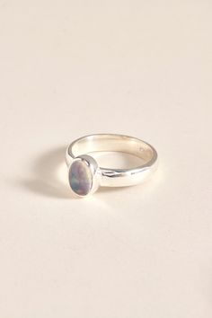 Our Ethiopian Opal ring is perfect for everyday wear. The ring is made using 925 sterling silver. The ring is available in size 7 3/4, 8.5, 8 3/4, 10. Dimensions: Total height: 9mm Total width: 7mm Stone height: 8mm Stone width: 6mm Stone + bezel thickness: 5mm Band width: 4mm - Please note - * Additional photos and videos available on request * Go to 'About us' section for links to our socials and website * Only the ring from first picture is included in the price. * Gemstones are natural material, they can slightly differ in color, size, shape and may show some inclusions or cracks inside the stone itself. We do take great care in picking the best quality stones for best quality jewellery. Everyday Oval Sterling Silver Rings, Sterling Silver Opal Ring With Round Band, Silver Everyday Rings With Gemstone, Classic Sterling Silver Toe Ring, Stackable Opal Ring With Round Band In Sterling Silver, Everyday Silver Rings With Gemstone, Everyday Silver Gemstone Rings, Sterling Silver Cabochon Opal Ring For Anniversary, Classic Sterling Silver Opal Ring Gift