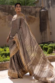 Grey saree with garden hand block print and hand weaved zari border. Comes with an unstitched blouse piece.
Components: 2
Pattern: Hand Block Printed
Type Of Work: Garden
Fabric: Pure Tussar Silk
Color: Grey
Other Details: 
Length of saree: 5.5 mtrs
Approx. product weight (in gms): 210
Note: Stitched blouse worn by the model is not for sale
Disclaimer: Since these products are handcrafted and hand dyed, hence may have slight irregularities and dissimilarities each time it is crafted. This is a n Block Printed Saree, Grey Saree, Garden Fabric, Block Print Saree, Printed Saree, Hand Block Print, Printed Sarees, Sarees Online, Blouse Piece