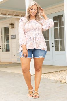 Everything will be just peachy when you wear this amazing top! This cutie has a super flattering smocked bodice with adorable ruffles on the shoulders! The floral pattern is so stunning and the peach color is neutral enough to pair with all of your faves! Style this with jean shorts and sandals for a super cute look! 100% Polyester Pink Smocked Top With Floral Print For Brunch, Pink Floral Smocked Top For Brunch, Feminine Flowy Smocked Top With Floral Print, Babydoll Top, Just Peachy, Jean Shorts, Ruffles, Floral Pattern, Super Cute