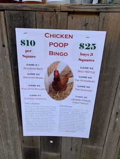 a chicken poop sign posted on the side of a wooden fence