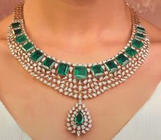 Emerald Green American Diamond Necklace by Tyaani combines elegance with Bollywood flair. This Gold Plated Designer Statement CZ Necklace is perfect for a Bollywood Wedding, offering intricate craftsmanship and vibrant green hues. Inspired by Indian aesthetics, it radiates luxury and charm, making it a standout piece for any special occasion. *𝐏𝐑𝐎𝐃𝐔𝐂𝐓 𝐃𝐄𝐓𝐀𝐈𝐋* * Material: Brass * Plating: Gold Plated. * Stone: Semi Precious Emerald. *𝐃𝐈𝐒𝐂𝐋𝐀𝐈𝐌𝐄𝐑* Product color may slightly v Exquisite Green Diamond Necklace For Formal Occasions, Exquisite Emerald Bridal Necklace, Emerald Pendant Diamond Necklace For Wedding, Exquisite Green Pendant Diamond Necklace, Exquisite Emerald Pendant Necklace For Weddings, Elegant Green Pendant Bridal Necklace, Exquisite Green Diamond Necklace, Dazzling Green Diamond Necklaces, Dazzling Green Diamond Necklace