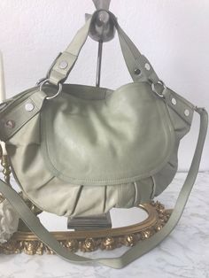 Barr and Barr sage green leather purse, Barr Barr green genuine leather calfskin handbag, Green leather large satchel handbag purse.  Genuine leather Polished silver toned hardware Top handle with detachable strap 4 Interior pockets, 1 Exterior pocket Excellent condition - Like new Height 13 Width 19 Straps: Top 16 Detachable 41 Khaki Leather Satchel With Leather Handles, Green Hobo Bag With Detachable Handle For Shopping, Elegant Green Hobo Bag, Modern Green Satchel With Detachable Handle, Green Modern Satchel With Detachable Handle, Khaki Leather Satchel With Double Handle, Elegant Green Satchel Hobo Bag, Luxury Green Hobo Tote Bag, Khaki Leather Double Handle Satchel