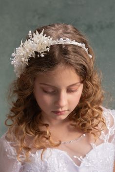 Flower headband for first holy communion in white tones with pearls... The flower headband is made of artificial flowers, preserved materials and other trinkets used for arranging. Elegant headpiece handcrafted with love. We also offer other headbands, floral belts, bracelets, head wreaths or candle decoration for first holy communion.  Dress: Svadobný salón Ľubica Photo: Michaela durisova photography Model: Vivien When stored in dry and dark place, our products last 10-15 years. We can also mak Communion Headband, Headband With Pearls, Communion Headpiece, Bridesmaid Headpiece, Bridesmaid Headband, Pearl Bridal Headband, Head Wreath, Hair Wreaths, Preserved Flowers