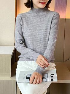 Features: Stay warm and stylish this winter with our Fashion Half Turtleneck Women Pullover Sweaters. Made with high-quality knitted material, this jumper top features a classic turtleneck design and long sleeves. Perfect for both casual and formal occasions, this basic solid sweater is a must-have for any winter wardrobe.