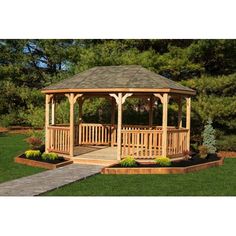 a wooden gazebo sitting on top of a lush green field