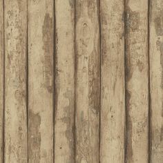 an old wooden fence with peeling paint on it