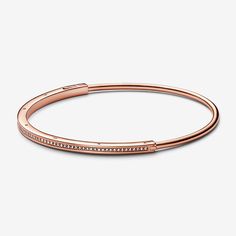 Elevate your outfit with the Pandora Signature I-D Pavé Bangle. Finished in 14k rose gold plating, this much-loved design features an architectural square-and-round profile with a channel of pavé for subtle sparkle. Stack with other Pandora Signature I-D bangles to create your own iconic look. - Pandora Signature I-D Pavé Bangle - 14k Rose gold-plated unique metal blend / Cubic Zirconia / Clear - Sz. 7.5 in Pandora Rose Gold, Pave Bangle, Classic Bangles, Elevate Your Outfit, Pandora Rose, The Bangles, Bracelet Pandora, Snake Chain Bracelets, Open Bangle