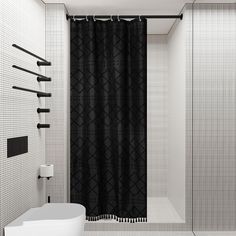 a black and white bathroom with a shower curtain