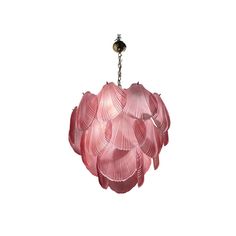 a pink chandelier hanging from a chain