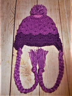 Very cute purple hat with pop pom. I bet your child will want to wear this hat all winter. Made with 4 ply acrylic yarn. Hat circumference is approx 15 inches. Will fit most toddlers. Hand washing and dry flat is recommended but can be machine washed on delicate and tumble dry low. READY TO SHIP Please contact me for international shipping rates Crochet Child Hat, Child Hat, Purple Hat, Purple Hats, Toddler Hat, Skull Cap Beanie, Crochet For Kids, Kids Hats, Winter Hat