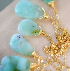 This stunning necklace is handmade with gorgeous specimens of natural Chrysoprase. This gem, also known as green Chalcedony, is said to promote joy and happiness, as well as attract love and prosperity. No two pendants are the same. Some are minty green, while others have flecks of brown, white, or black within them. The chains are sterling silver or 14k gold filled. So go ahead, flaunt your unique style! GEMSTONE: Chrysoprase STONE SIZE: 20 to 32mm (.78 to 1.25") STONE SHAPE: Irregular Smooth P Prehnite Gemstone Beads Necklace For Gift, Nature-inspired Chrysoprase Necklaces, Handmade Chrysoprase Necklaces In Nature Style, Nature-inspired Chrysoprase Necklaces As Gift, Nature-inspired Chrysoprase Necklace As Gift, Gold Chrysoprase Pendant Necklace, Gold Prehnite Jewelry As A Gift, Gold Chrysoprase Necklaces As A Gift, Gold Chrysoprase Necklace For Gift