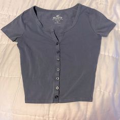 Great Condition! Never Worn. Blue Short Sleeve T-shirt With Buttons, Trendy Blue Tops With Snap Buttons, Casual Fitted Button Top, Trendy Gray Button-up Top, Blue Tops With Snap Buttons For Summer, Blue Short Sleeve Top With Snap Buttons, Blue Short Sleeve Tops With Snap Buttons, Fitted Casual T-shirt With Button Closure, Blue Summer Tops With Snap Buttons