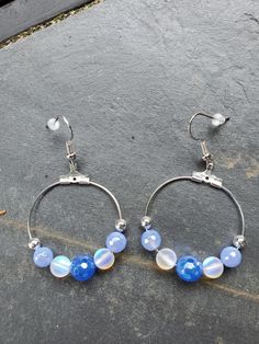 These earrings are made with blue agate beads plated with a silver coating that provides a lot of shine. The clear stones are moonstone beads that flash with color. They are made so that the hoops face forward. Face Forward, Moonstone Beads, Clear Stone, Blue Agate, Agate Beads, Jewelry Earrings Hoops, Columbus, Moonstone, Etsy Earrings