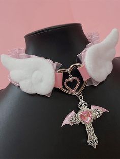 Elevate your Kawaii fashion game with our rhinestoned cross pendant blue/pink Jirai Kei angel wings PU choker. This stunning choker features a delicate PU leather band adorned with a rhinestoned cross pendant in a choice of blue or pink, perfectly capturing the ethereal essence of Jirai Kei style. The angel wings design adds a touch of whimsy and fantasy, making it a must-have accessory for any Kawaii wardrobe.  Please note that this product includes the choker only. Pastel Goth Jewelry, Cutecore Accessories, Chokers Aesthetic, Cute Accessories Kawaii, Angelic Fashion, Kawaii Wardrobe, Yami Kawaii Fashion, Cute Angel Wings, Pastel Goth Choker