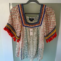 Maeve Paolina Tasseled Blouse Nwt. Never Worn. Size Xs - Runs Big- Fits Like A Small/Medium. Embrace A Sense Of California Cool With Sunshine-Y Details, Like This Blouse's Colorful Tassels And Embroidery. Rayon Embroidered Detail Tasseled Trim Square Neck Pullover Styling Machine Wash Imported Summer Short Sleeve Blouse With Tassels, Summer Blouse With Tassels And Short Sleeves, Casual Vacation Blouse With Fringe, Casual Fringe Blouse For Vacation, Multicolor Summer Tops With Tassels, Summer Vacation Peasant Top With Tassel Ties, Summer Peasant Top With Tassels, Summer Peasant Top With Tassel Ties For Vacation, Multicolor Bohemian Top With Tassels