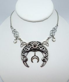 This is a new handmade necklace. It is made with antiqued silver plated celtic knots and crescent moons, accented with a high quality HEMATITE GRAY glass rhinestones that sparkles like crystal. Decorated portion is 5 1/4" wide and 1 7/8" tall in the center. Necklace is adjustable 15-18" with a lobster clasp and chain extender. If you would like a different length, please send us a message.Matching headpiece is listed in our store in a variety of stone colors. If you don't see items with a color Celtic Knots, Choker Pendant, Chain Extenders, Moon Goddess, Crystal Ab, Amethyst Purple, Necklace Choker, Purple Glass, Knot Necklace