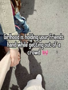 two people holding hands with the caption girl hood is holding your friends hand while getting out of a crowd