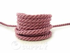 a pink rope is shown on a white background