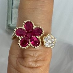 Beautiful Ruby Diamond Ring Yellow Gold.  Excellent craftsmanship, the rubies are well matched and the diamonds are nice and sparkling.  Look how beautiful the beading detail around the ruby and diamonds.  All stones set nice and smooth, ideal for everyday wear.  The big Ruby flower measures about 11.5mm and the small flower measures about 5.5mm.  Very comfortable ring to wear on any finger.   Genuine earth mined ruby Total weight: 1.70 Carats Beautiful color Heated Genuine earth mined round bri Luxury Ruby Cluster Ring, Cluster Ruby Ring With Diamonds, Luxury Ruby Cluster Jewelry, Red Ruby Diamond Multi-stone Ring, Red Ruby Multi-stone Ring With Diamonds, Cluster Ruby Diamond Ring, Exquisite Ruby Ring With Diamond Accents, Red Ruby Cluster Ring With Rose Cut Diamonds, Diamond Cluster Ruby Ring With Diamond Accents