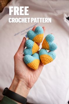 a person holding four crocheted balls in their hand with the text free crochet pattern