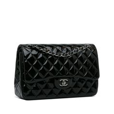 The Chanel Classic Double Flap is probably one of the most coveted bags in the world. With its elegant and timeless design, its origins can be traced back to the 2.55 model from 1955. The iconic CC Lock was only created later through the magic of Karl Lagerfeld. Made from the finest glossy leather, the Bag has an outside pocket on the back. Coco Chanel's secret zippered compartment can be found on the inside of the front flap. The inside flap can be closed at the touch of a button. There are two Chanel Jumbo, Water Mark, Fashion Icon, Cc Logo, Leather Silver, Early 1900s, Leather Chain, Coco Chanel, French Style