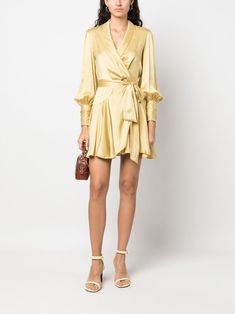 wrap silk dress from ZIMMERMANN featuring mustard yellow, silk, satin finish, wrap design, shawl lapels, long sleeves and side tie fastening. Size and Fit - This piece fits true to size. We recommend you get your regular size. Model is 1,75m / 5ft 8in wearing size 1 (NUM) Silk Wrap Dress With Surplice Neckline For Cocktail, Long Sleeve Satin Wrap Dress For Fall, Gold Silk Dress With Long Sleeves, Gold Silk Long Sleeve Dress, Fall Silk Wrap Dress, Dresses Yellow, Yellow Silk, Latest Fashion Design, Zimmermann Dress