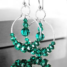 Dainty, emerald green hoop earrings featuring RARE Swarovski crystals beaded onto sparking Sterling silver hoops and suspended from Sterling silver ear-wires.  Nice gift idea for May birthday Lady :)  More details: - ALL .925 Sterling silver - handcrafted hook ear-wires, textured 20mm hoops and links  - Brilliant, faceted Swarovski crystal (3-6mm)  - The earrings are approx. 1 3/4" (43 mm) in total length Here, you can view more EMERALD GREEN jewelry, in my shop: https://www.etsy.com/shop/DorotaJewelry?ref=hdr_shop_menu&search_query=emerald Here, you can view HOOP EARRINGS, in my shop: https://www.etsy.com/shop/DorotaJewelry?ref=hdr_shop_menu&search_query=hoop+earrings --- Please, keep in mind that the jewelry in the photographs looks larger than it does in person. I post close up pictures Green Hoop Earrings, Birthday Lady, Emerald Green Jewelry, Emerald Green Crystal, Emerald Crystal, Earring Making, Crystal Hoop Earrings, Business Products, Green Jewelry