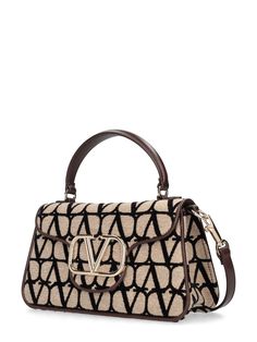 Height: 14cm Width: 26cm Depth: 8cm. Strap drop: 54.5cm. Handle drop: 8cm. Detachable leather strap. Single top handle. Front flap with snap button closure. Front metal logo detail. All over print placement may vary Print Placement, Metal Logo, Metallic Logo, Valentino Garavani, Snap Button, All Over Print, Top Handle, Metallica, Leather Straps