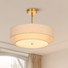 a light fixture hanging from the ceiling in a living room