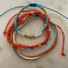 Set Of 3 Bracelets, Beaded Accents Orange And Blue With Green, Yellow, And White Accents 6.3-10 Inch Circumference Waterproof And Fade Proof! Bohemian Orange Friendship Bracelets For Vacation, Casual Orange Braided Bracelets For Friendship, Casual Orange Braided Bracelet For Friendship, Orange Bohemian Beaded Bracelets For Vacation, Bohemian Orange Beaded Bracelets For Vacation, Casual Blue Beaded Bracelets For Festivals, Handmade Orange Casual Friendship Bracelet, Casual Handmade Orange Friendship Bracelets, Casual Handmade Orange Friendship Bracelet