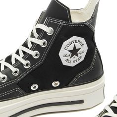 Embrace a fusion of classic and contemporary design with the Converse Chuck 70 De Luxe Squared Sneakers. These sneakers, with their sturdy canvas uppers and faux leather overlays, offer a geometric aesthetic that's both striking and stylish. The angular details, combined with a robust rubber midsole and OrthoLite cushioning, ensure optimal comfort..Canvas Uppers.Faux Leather Overlays.Rubber Midsole.OrthoLite Cushioning.Silver-Toned Eyelets.Brand Patches.Shop All Converse Sneakers All Converse, Geometric Aesthetic, Shoes Outfit Fashion, Converse Chuck 70, Shoes Outfit, Chuck 70, Converse Sneakers, Mens Sportswear, Men's Sneakers