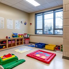 an empty classroom with lots of toys on the floor