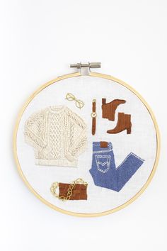 a cross - stitch pattern with various items on it, including boots and sweaters