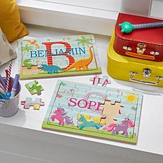 children's personalized puzzles and pencils are on the window sill